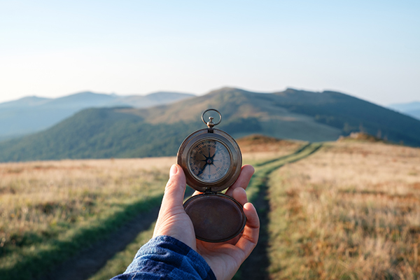 Picture of a person holding a compass